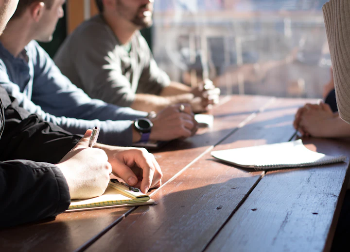 Team working together around a meeting table